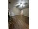 Spacious living room with a stone fireplace, vaulted ceiling, and new flooring at 3013 Rockview Dr, Loganville, GA 30052