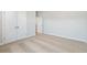 Bedroom featuring neutral carpet, white walls, baseboards and trim, double closet and a white door at 630 Silva St, Cumming, GA 30040