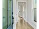Inviting entry hallway with natural light, hardwood flooring, and neutral paint at 630 Silva St, Cumming, GA 30040