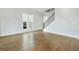 Bright living room with hardwood floors and staircase at 630 Silva St, Cumming, GA 30040