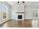 Bright living room boasts hardwood floors and a cozy fireplace at 630 Silva St, Cumming, GA 30040