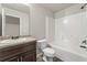 Bathroom featuring a large vanity, framed mirror, and a combination shower and tub at 1831 Broad River Rd, Atlanta, GA 30349