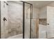 Sleek walk-in shower, tile walls, and a separate soaking tub in the primary bathroom at 1831 Broad River Rd, Atlanta, GA 30349
