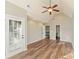 Bedroom featuring a vaulted ceiling, ceiling fan, and two doorways for an optional bathroom or closet space at 1831 Broad River Rd, Atlanta, GA 30349