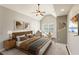 Cozy bedroom with a vaulted ceiling, ceiling fan, neutral color scheme, and lots of natural light at 1831 Broad River Rd, Atlanta, GA 30349