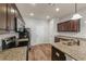 Kitchen showcasing granite counters, stainless appliances, and wood cabinets at 1831 Broad River Rd, Atlanta, GA 30349