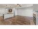 Living room featuring fireplace and a view of the kitchen with granite countertops at 1831 Broad River Rd, Atlanta, GA 30349