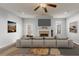 Bright living room with fireplace, ceiling fan, and neutral decor at 1831 Broad River Rd, Atlanta, GA 30349