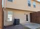 Back of townhome with patio, door, window, siding, and AC unit at 1831 Broad River Rd, Atlanta, GA 30349