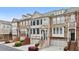 Townhome exterior with a mix of brick and stone, creating an inviting and stylish facade at 2517 Ashwicke Se Dr, Atlanta, GA 30339