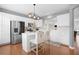 Bright kitchen featuring white cabinetry, stainless steel appliances, and a marble-topped island at 2517 Ashwicke Se Dr, Atlanta, GA 30339
