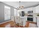 Well-lit kitchen with white cabinets, modern appliances, and a center island with seating for two at 2517 Ashwicke Se Dr, Atlanta, GA 30339
