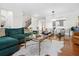 Bright living room and dining room with gorgeous hardwood floors, modern lighting, and stylish decor at 2517 Ashwicke Se Dr, Atlanta, GA 30339