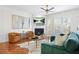 Inviting living room featuring a fireplace, large windows, and comfortable seating arrangement for relaxation at 2517 Ashwicke Se Dr, Atlanta, GA 30339