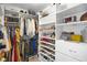 Organized walk-in closet featuring shelving, hanging racks, and storage space for clothes, shoes, and accessories at 2517 Ashwicke Se Dr, Atlanta, GA 30339