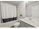 Clean bathroom with a shower-tub combo and coordinated fixtures at 7005 Livia Pt, Riverdale, GA 30296