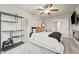Bright bedroom featuring a plush carpet, ceiling fan, and modern furnishings at 7005 Livia Pt, Riverdale, GA 30296