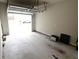 Spacious garage with an open door, providing ample parking and storage space at 7005 Livia Pt, Riverdale, GA 30296