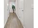 Hallway with hard floors and a decorative plant at 7005 Livia Pt, Riverdale, GA 30296