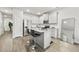Modern kitchen with granite countertops, stainless steel appliances, and barstool seating at 7005 Livia Pt, Riverdale, GA 30296