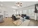 Cozy living room with hardwood floors, modern decor, and recessed lighting at 7005 Livia Pt, Riverdale, GA 30296