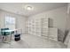 Spacious office with natural light, built in bookcases, and modern furniture at 7005 Livia Pt, Riverdale, GA 30296