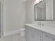 Bathroom featuring a large mirror, vanity with gray cabinets, and tile flooring at 123 Candler Loop, Acworth, GA 30101