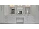 Bathroom vanity with double sinks, marble countertop, three mirrors, and modern fixtures at 123 Candler Loop, Acworth, GA 30101