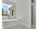 Modern bathroom features a freestanding tub, large window, and a glass-enclosed shower at 123 Candler Loop, Acworth, GA 30101