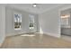 Spacious bedroom with wood floors and two large windows offering natural light at 123 Candler Loop, Acworth, GA 30101