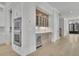 Butler pantry with a beverage refrigerator, display cabinets and lots of countertop space at 123 Candler Loop, Acworth, GA 30101