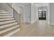 Foyer features a staircase, hardwood floors, and a view to the front door at 123 Candler Loop, Acworth, GA 30101