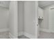 Hallway leading to a laundry room; large space that can be used as a walk-in pantry at 123 Candler Loop, Acworth, GA 30101