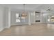 Bright, open living area featuring a modern fireplace and light hardwood flooring at 123 Candler Loop, Acworth, GA 30101