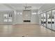 Bright living room with modern fireplace, hardwood floors, and sliding glass doors to patio at 123 Candler Loop, Acworth, GA 30101