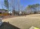 Expansive backyard with lush lawn and mature trees, offering privacy and space for outdoor activities at 142 Richmond Way, Villa Rica, GA 30180