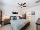 Comfortable bedroom with a decorative sign, ceiling fan, and ensuite bathroom access at 142 Richmond Way, Villa Rica, GA 30180