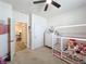 Bright bedroom with a house-shaped bed frame and access to a walkway at 142 Richmond Way, Villa Rica, GA 30180