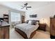 Inviting bedroom featuring neutral tones, a ceiling fan, and cozy furnishings at 142 Richmond Way, Villa Rica, GA 30180