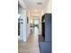 Bright hallway featuring light wood flooring and storage solutions, leading to living areas at 142 Richmond Way, Villa Rica, GA 30180