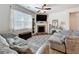 Comfortable living room with a fireplace, neutral decor, and cozy seating arrangements at 142 Richmond Way, Villa Rica, GA 30180