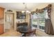 Charming breakfast nook with large window, decorative valance, and classic chandelier at 1566 Arden Sw Dr, Marietta, GA 30008
