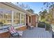 Inviting brick home exterior with a wooden deck and patio chairs, perfect for outdoor relaxation at 1566 Arden Sw Dr, Marietta, GA 30008