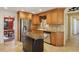 Traditional kitchen features wooden cabinets, granite countertops, and stainless steel appliances at 1566 Arden Sw Dr, Marietta, GA 30008