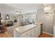 Open-concept living room with bar area and a view to the dining room at 1566 Arden Sw Dr, Marietta, GA 30008