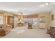 Bright living room with neutral carpet, large windows, and comfortable seating area at 1566 Arden Sw Dr, Marietta, GA 30008
