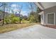 Backyard view featuring the patio, lawn, trees and the neighboring home at 2121 Whitekirk Nw St, Kennesaw, GA 30152