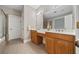 Bathroom featuring double sink vanity, tile flooring and walk-in shower at 2121 Whitekirk Nw St, Kennesaw, GA 30152