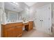Bathroom featuring double sink vanity, tile flooring, vanity and walk-in shower at 2121 Whitekirk Nw St, Kennesaw, GA 30152