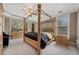 Main bedroom features a ceiling fan, carpet floors, and large windows at 2121 Whitekirk Nw St, Kennesaw, GA 30152